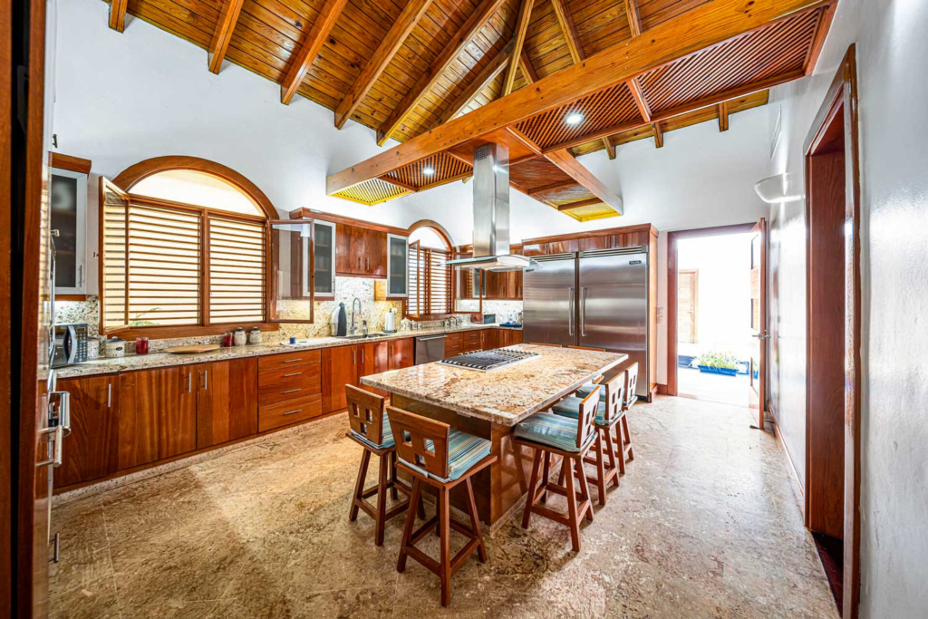 Kitchen and breakfast table beneath timber beams