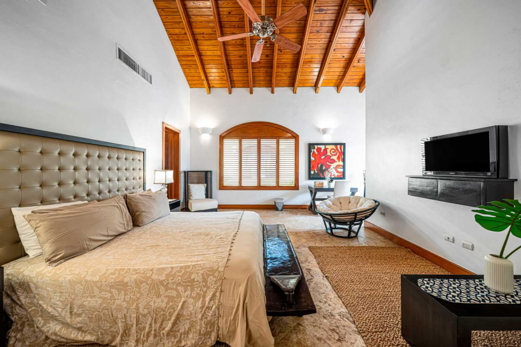 Bedroom with upholstered bed and seating area