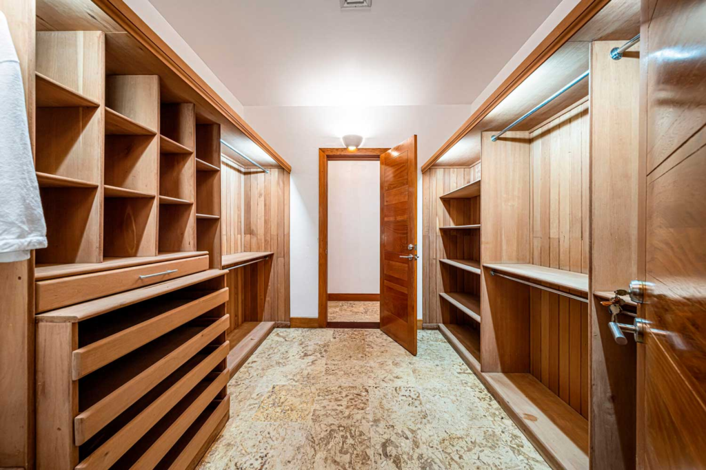 Walk-in closet with wood cabinetry