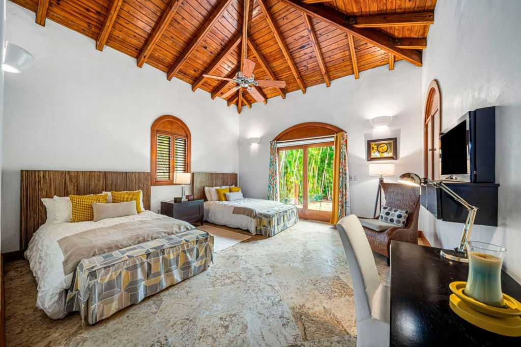 Bedroom with twin beds and vaulted timber ceiling