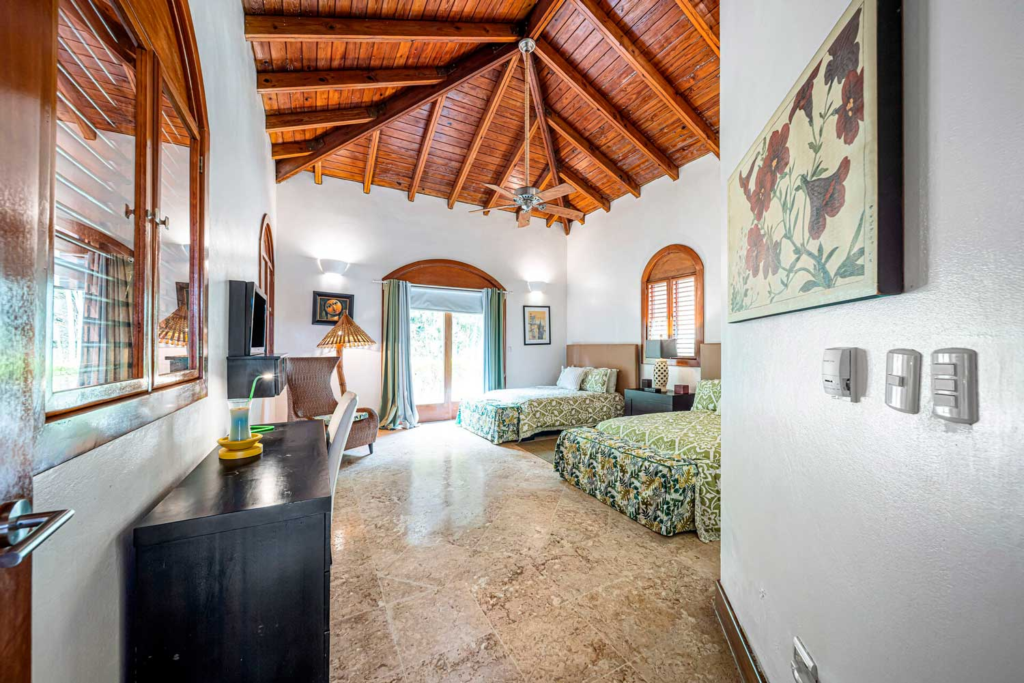 Bedroom with glazed doors and timber roof