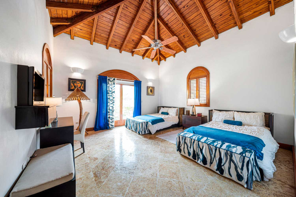 Twin-bed bedroom with vaulted timber ceiling